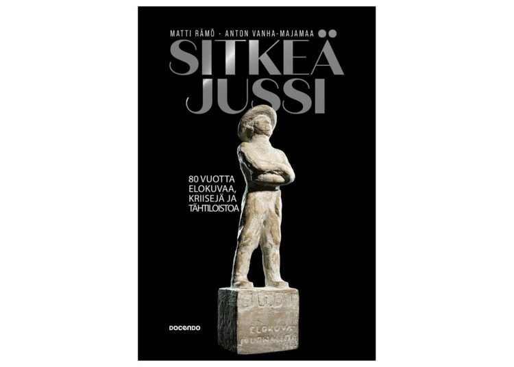 Sitkeä Jussi -kirjan kannessa Ben Renvallin suunnittelema Jussi-patsas.